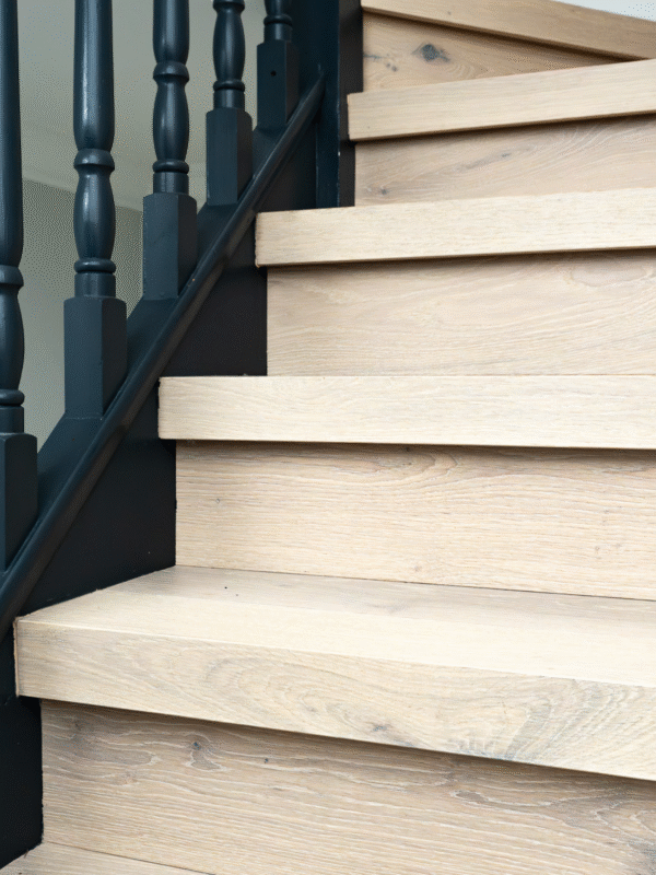 Light hardwood stairs in hallway